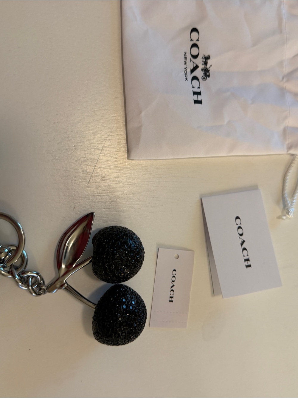 NWT Coach Crystal Cherry Bag Charm Black Silver Hardware Dust Bag Included